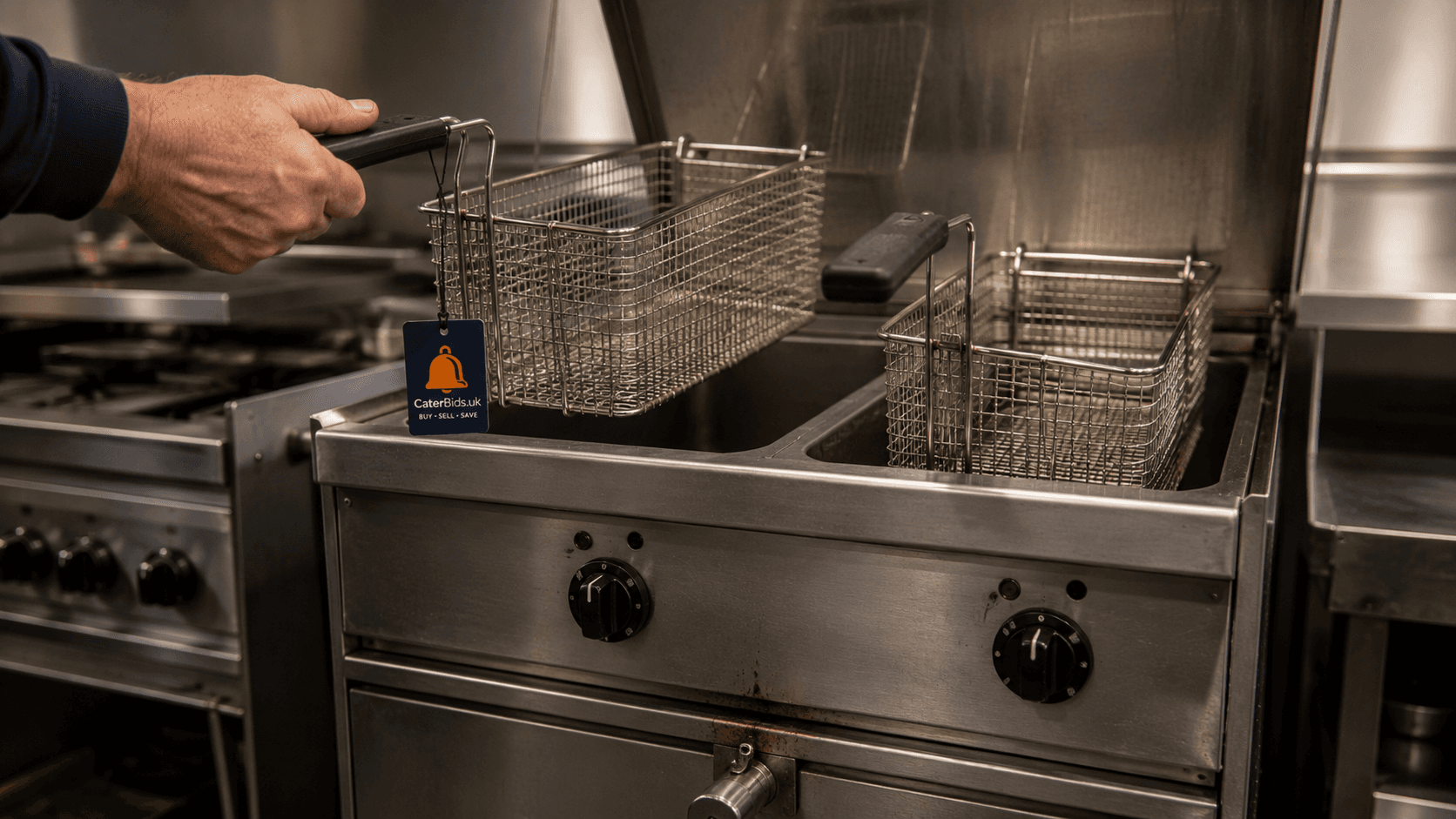 Used twin-basket commercial fryer with its lid open and baskets raised, ready for a pre-purchase check.